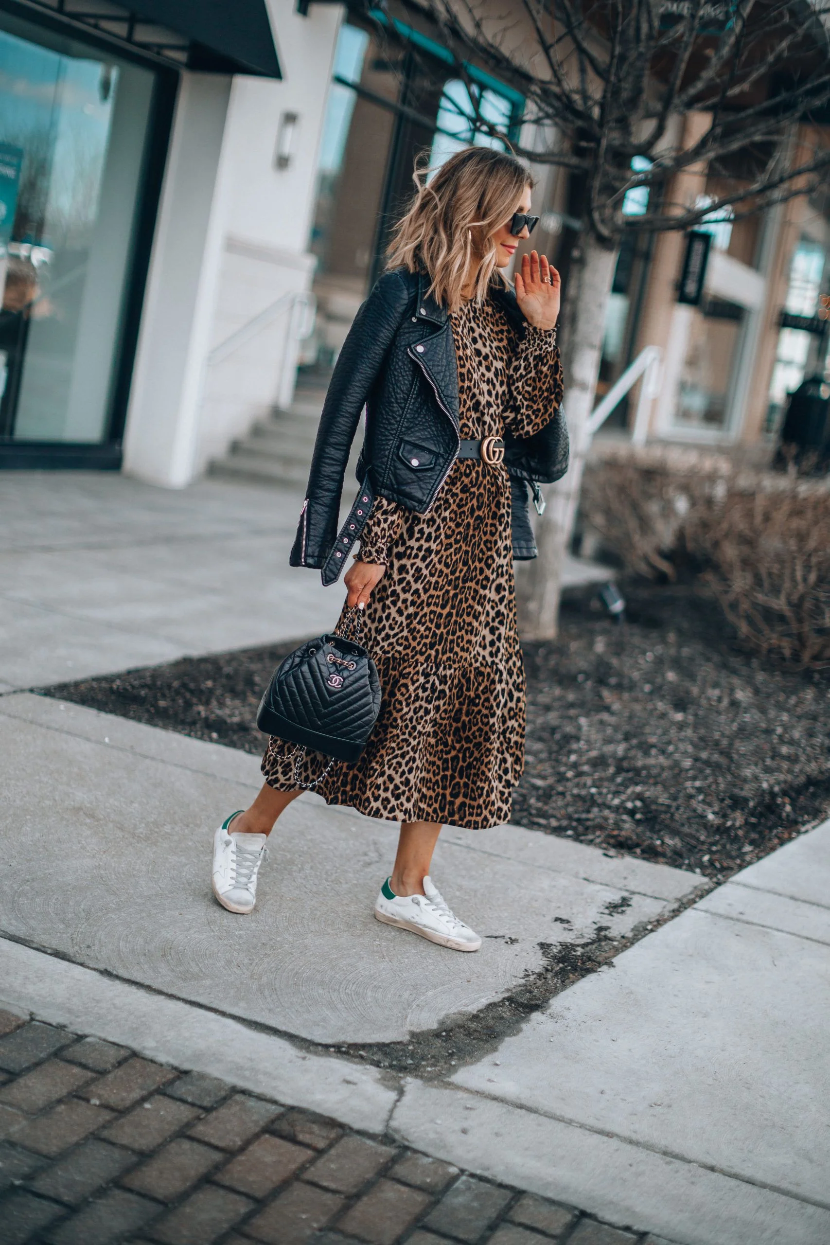 Modern Casual Luxury Outfit — This outfit effortlessly blends sophisticated animal print with edgy leather elements, creating a contemporary casual-luxury aesthetic