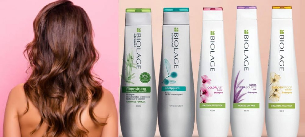 Back side view of shirtless, naked, attractive, young girl straighten her hair, having trendy, modern manicure, preparing for date, isolated on pink background